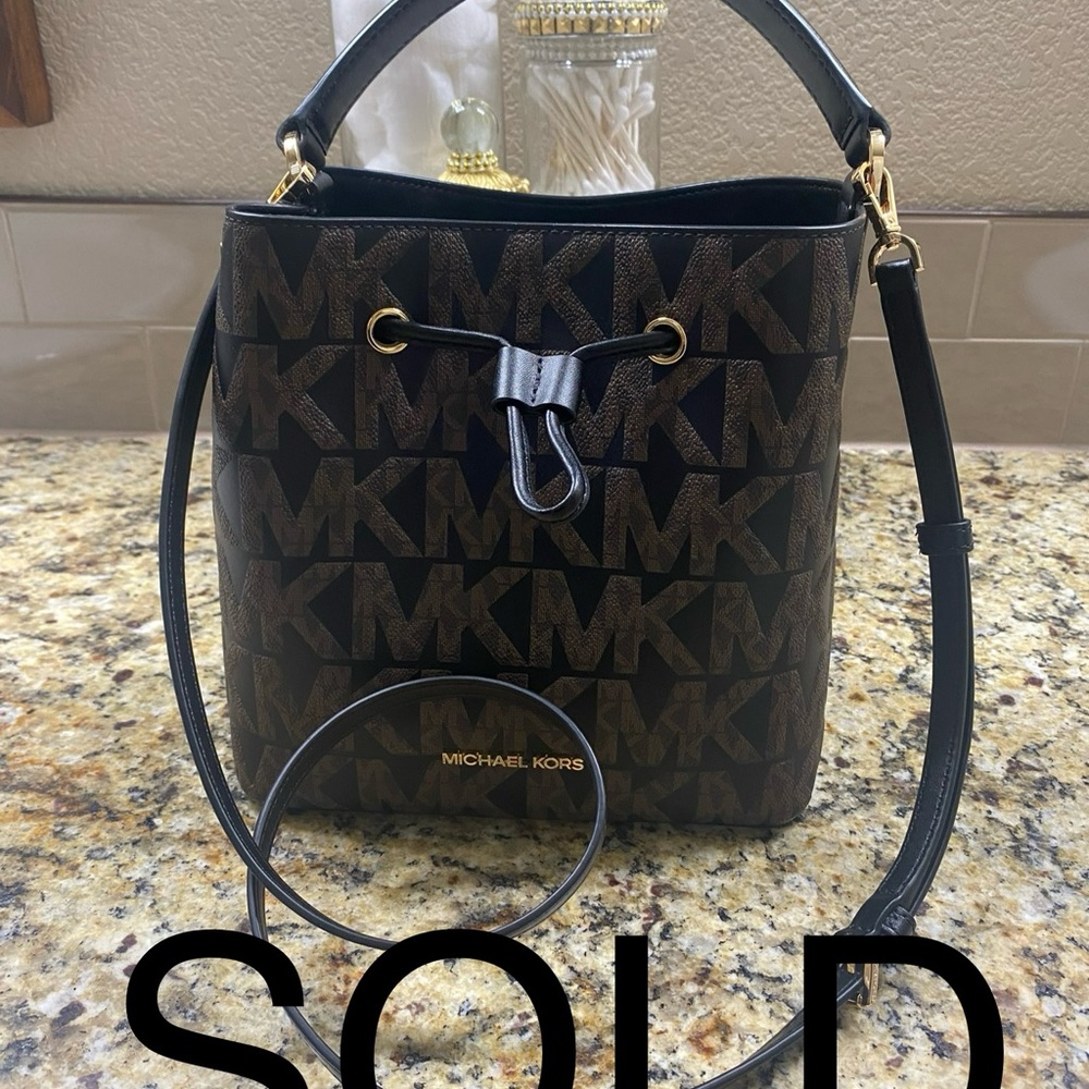 Suri Medium Bucket Messenger MK Logo Signature PVC Crossbody Bag